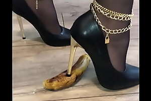 I put on my high heels and crush a banana in them