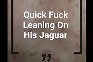 Leaning on his Jaguar