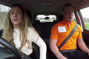 Long-haired MILF blows her car impelling school